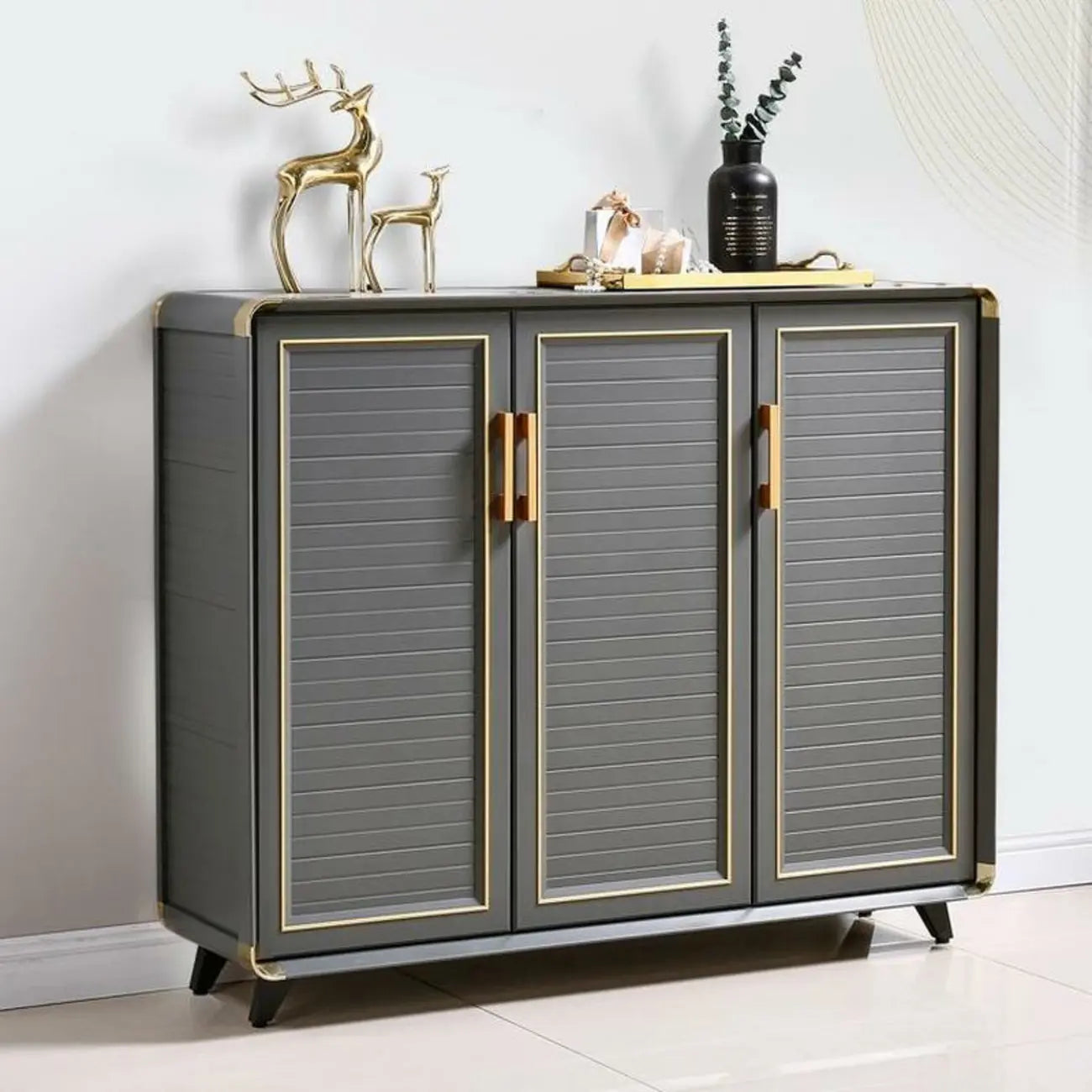 Meuble à chaussures d'entrée luxueux en métal gris avec finitions dorées