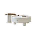 Table basse ronde élégante en bois crème avec tiroirs