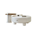 Table basse ronde élégante en bois crème avec tiroirs