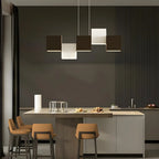 Îlot de cuisine moderne en forme de cube noir avec éclairage LED dimmable