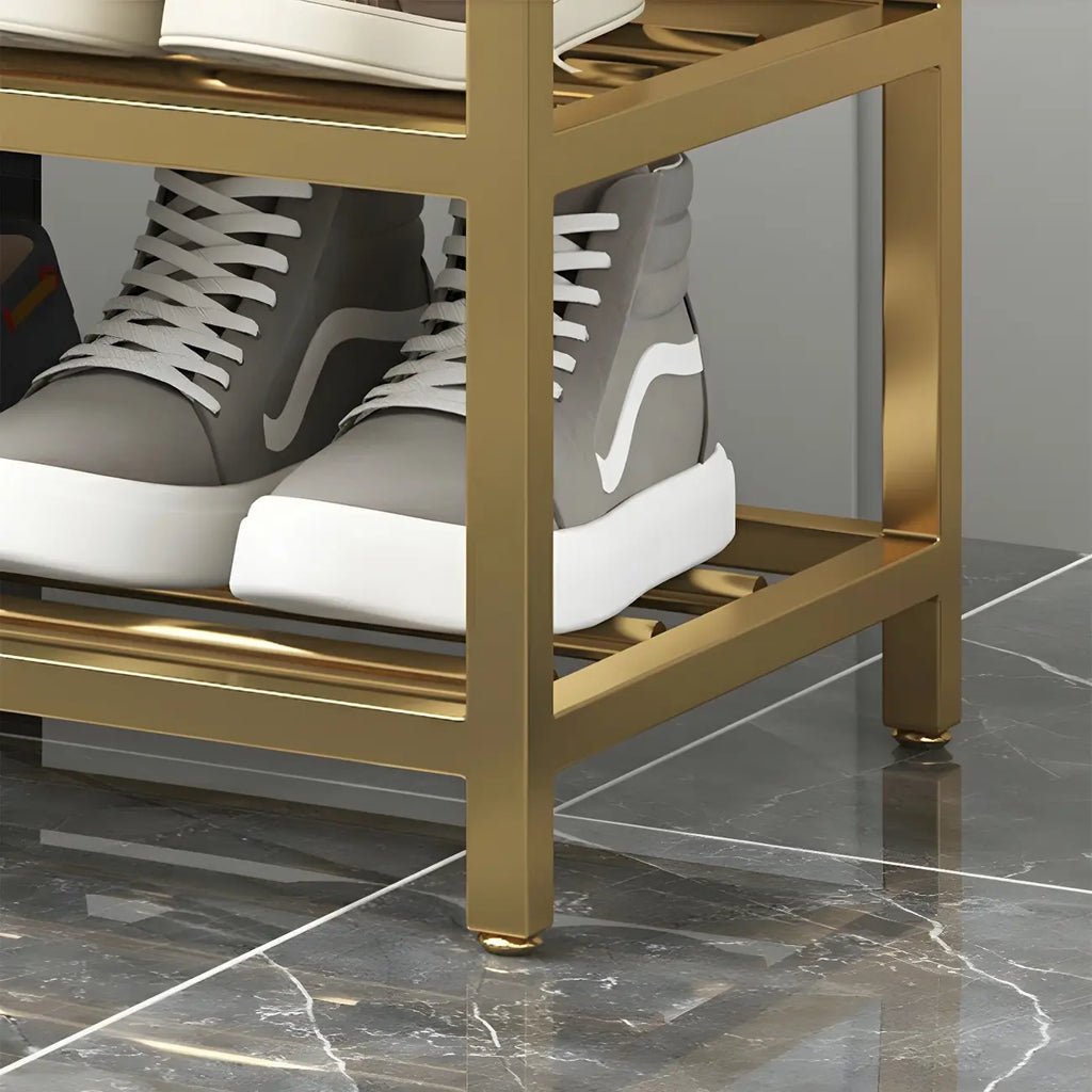 Étagère à chaussures grise capitonnée avec cadre doré pour entrée