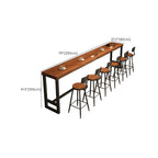 Table de bar rectangulaire en pin brun avec piètement en acier