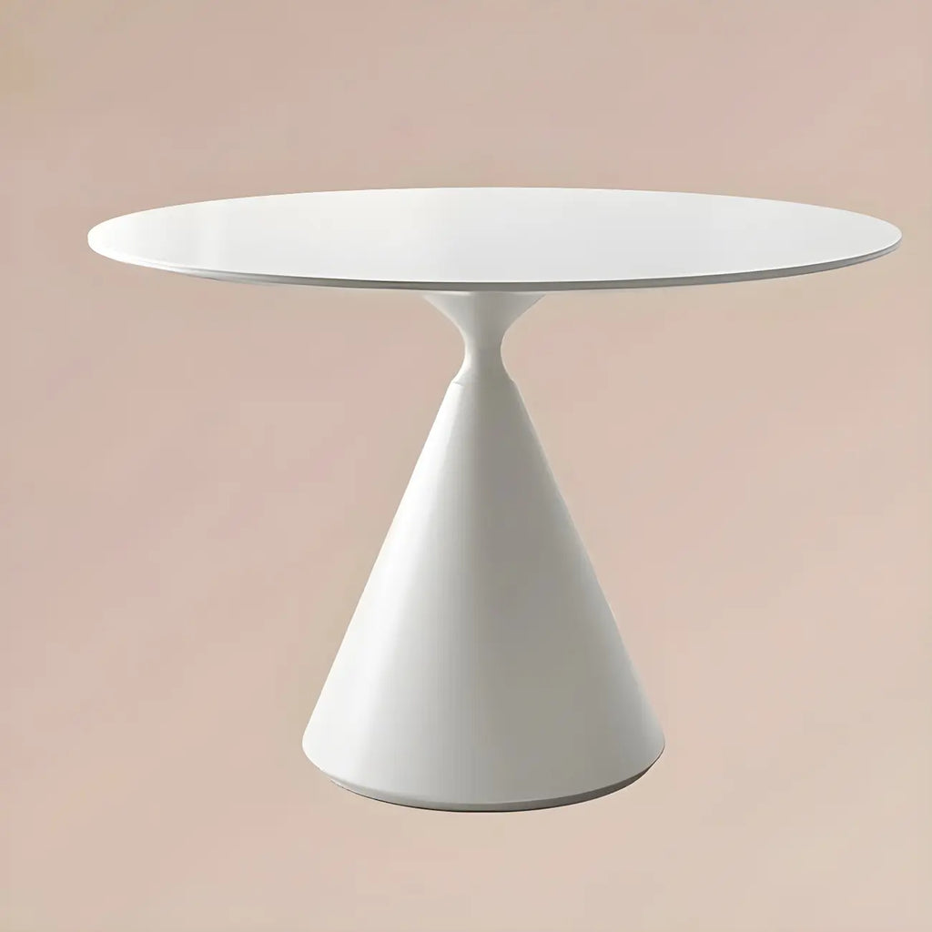 Table de salle à manger ronde avec plateau en pierre et piètement en métal, idéale pour les petits espaces.