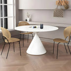 Table de salle à manger ronde avec plateau en pierre et piètement en métal, idéale pour les petits espaces.