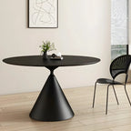 Table de salle à manger ronde avec plateau en pierre et piètement en métal, idéale pour les petits espaces.