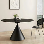 Table de salle à manger ronde avec plateau en pierre et piètement en métal, idéale pour les petits espaces.
