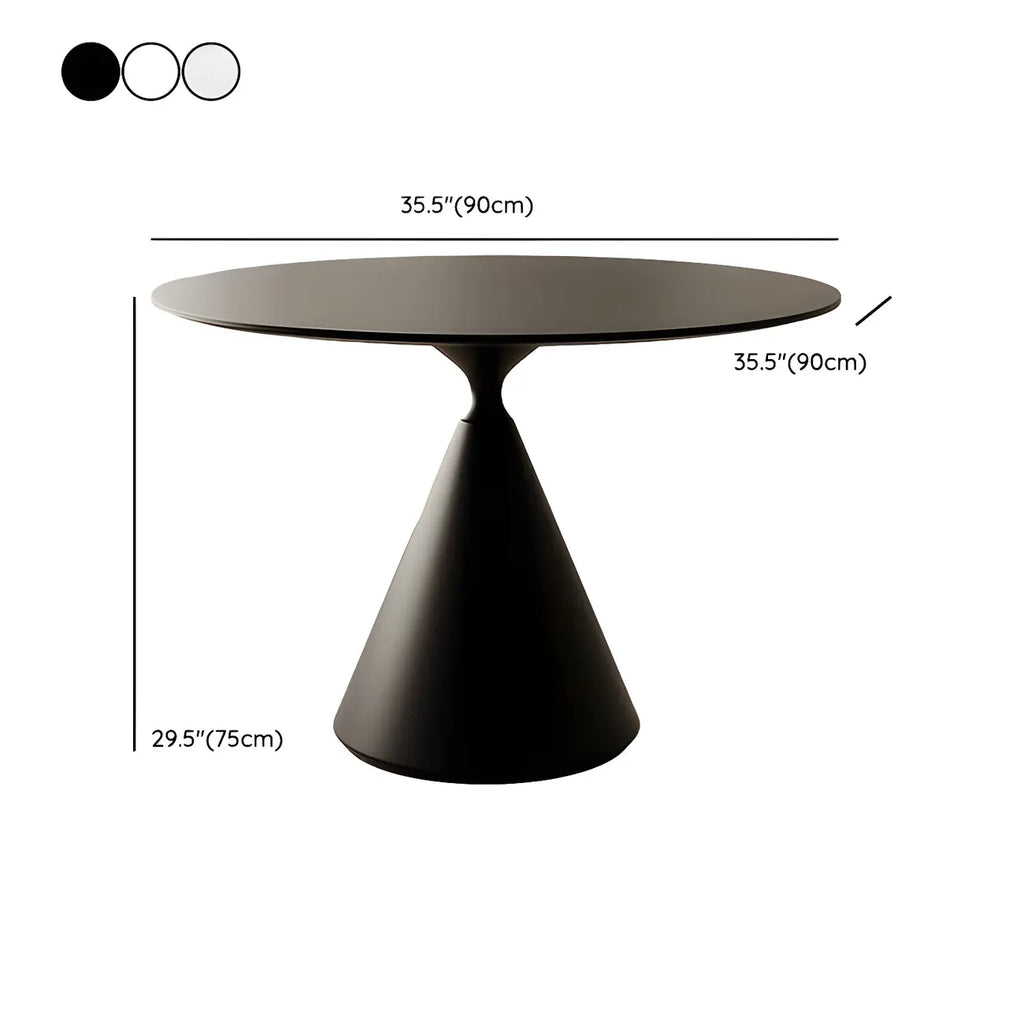 Table de salle à manger ronde avec plateau en pierre et piètement en métal, idéale pour les petits espaces.