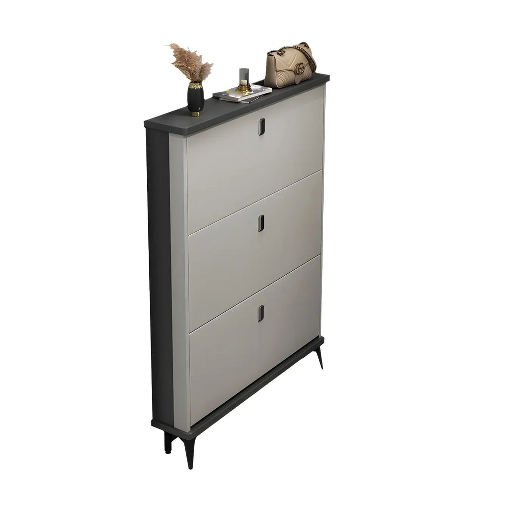 Armoire à chaussures d'entrée grise et blanche à façade rabattable