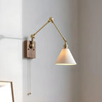 Applique da parete in ottone anticato con braccio orientabile e paralume in ceramica bianca