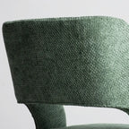 Chaise de salle à manger moderne en coton et lin vert, recouverte d'un revêtement en coton.