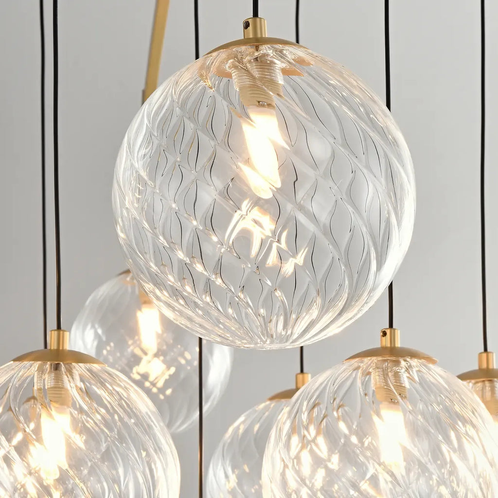Lustre sphérique en verre doré et cristal, design moderne et élégant