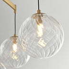 Lustre sphérique en verre doré et cristal, design moderne et élégant