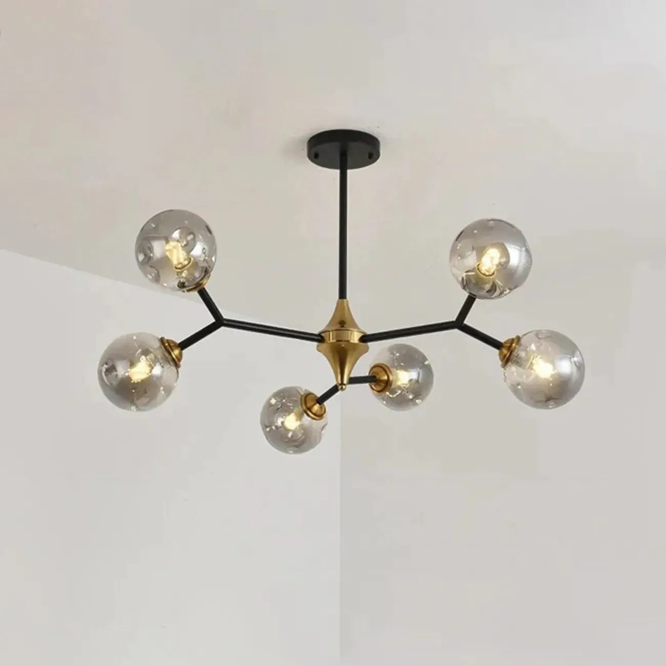 Lustre Sputnik moderne en verre noir et or