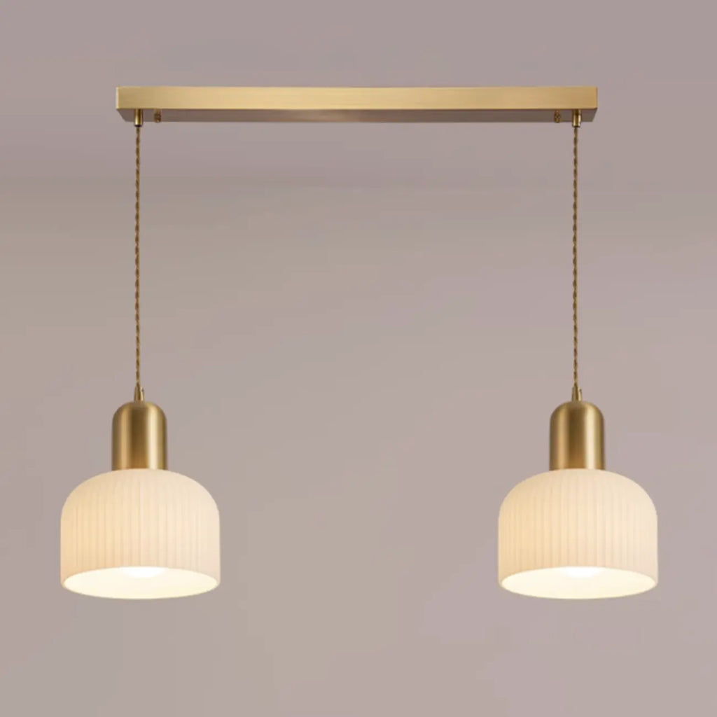 Luminaire cylindrique moderne en verre blanc et or pour îlot de cuisine