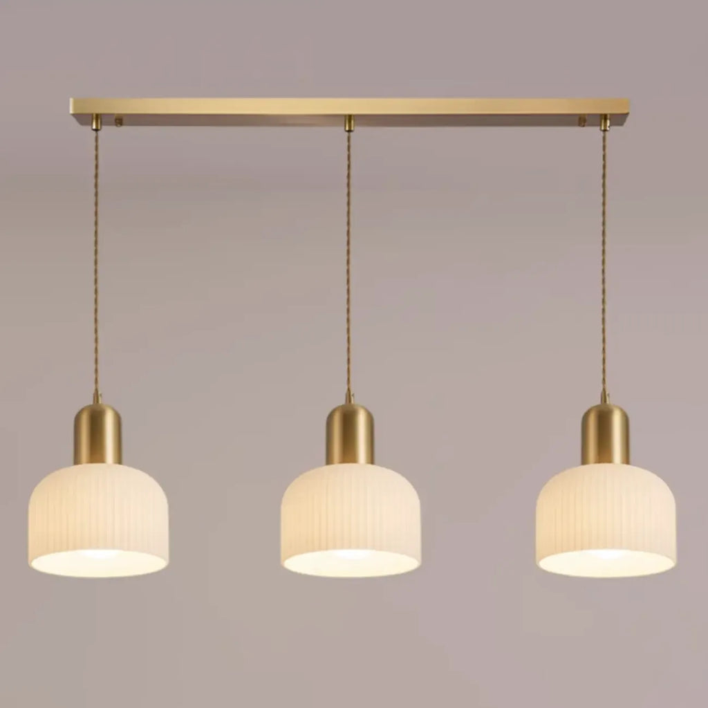 Luminaire cylindrique moderne en verre blanc et or pour îlot de cuisine