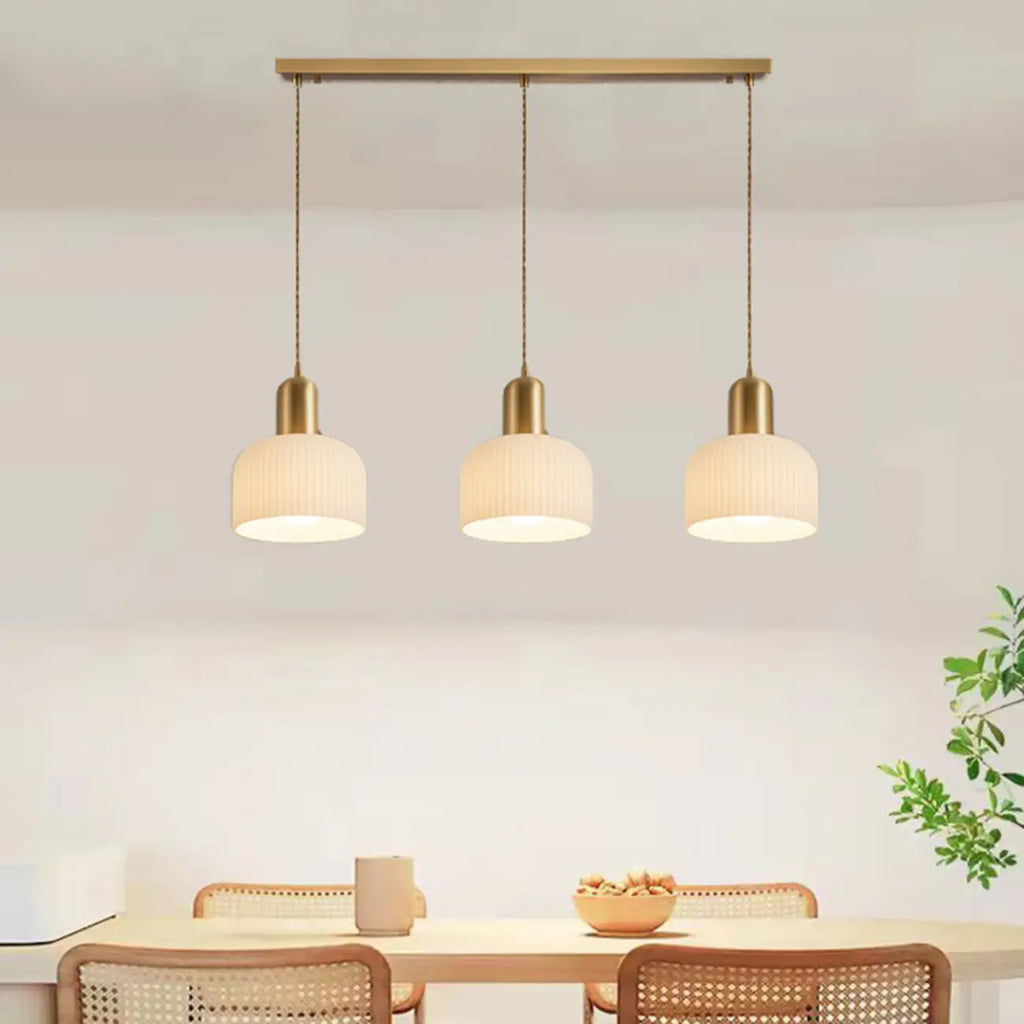 Luminaire cylindrique moderne en verre blanc et or pour îlot de cuisine