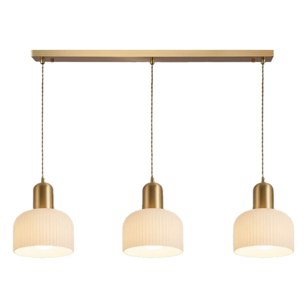 Luminaire cylindrique moderne en verre blanc et or pour îlot de cuisine