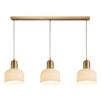 Luminaire cylindrique moderne en verre blanc et or pour îlot de cuisine