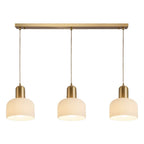Luminaire cylindrique moderne en verre blanc et or pour îlot de cuisine