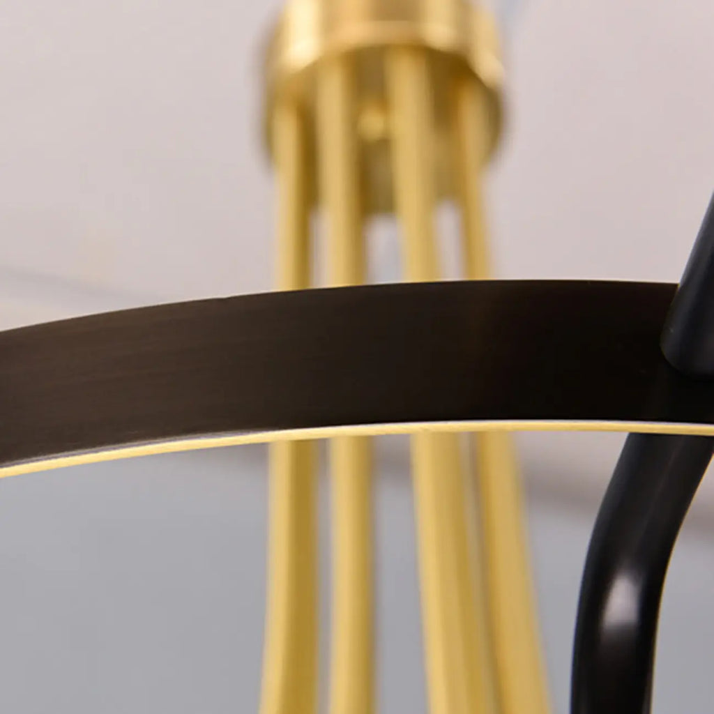 Lustre moderne rond noir et or avec abat-jour en verre transparent