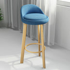 Tabouret de bar élégant et confortable, revêtu de tissu.