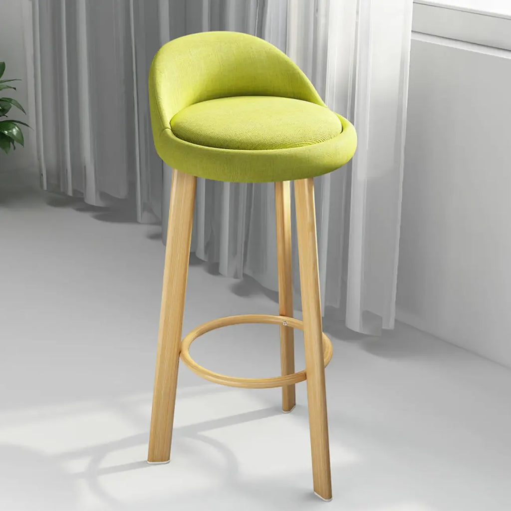 Tabouret de bar élégant et confortable, revêtu de tissu.