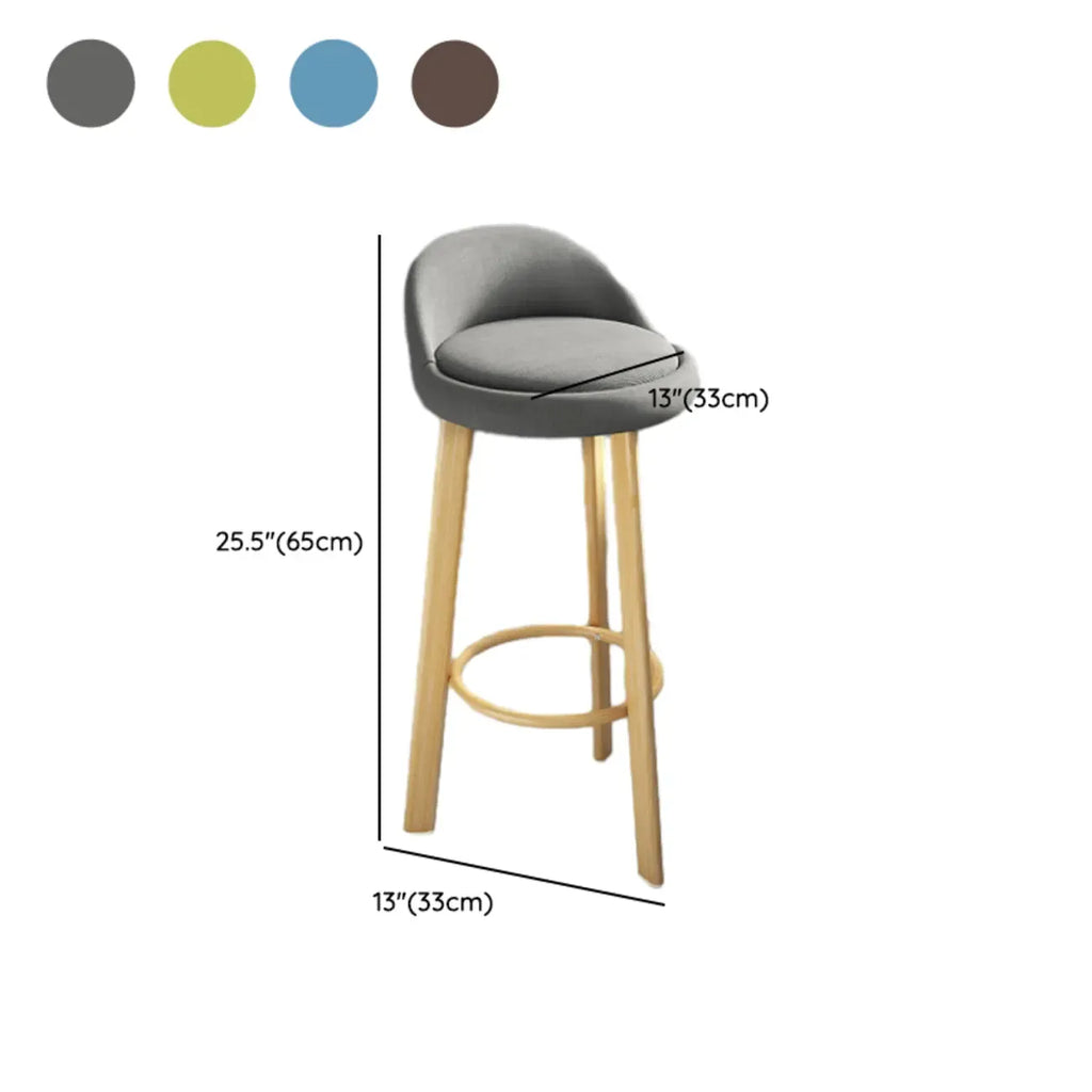 Tabouret de bar élégant et confortable, revêtu de tissu.