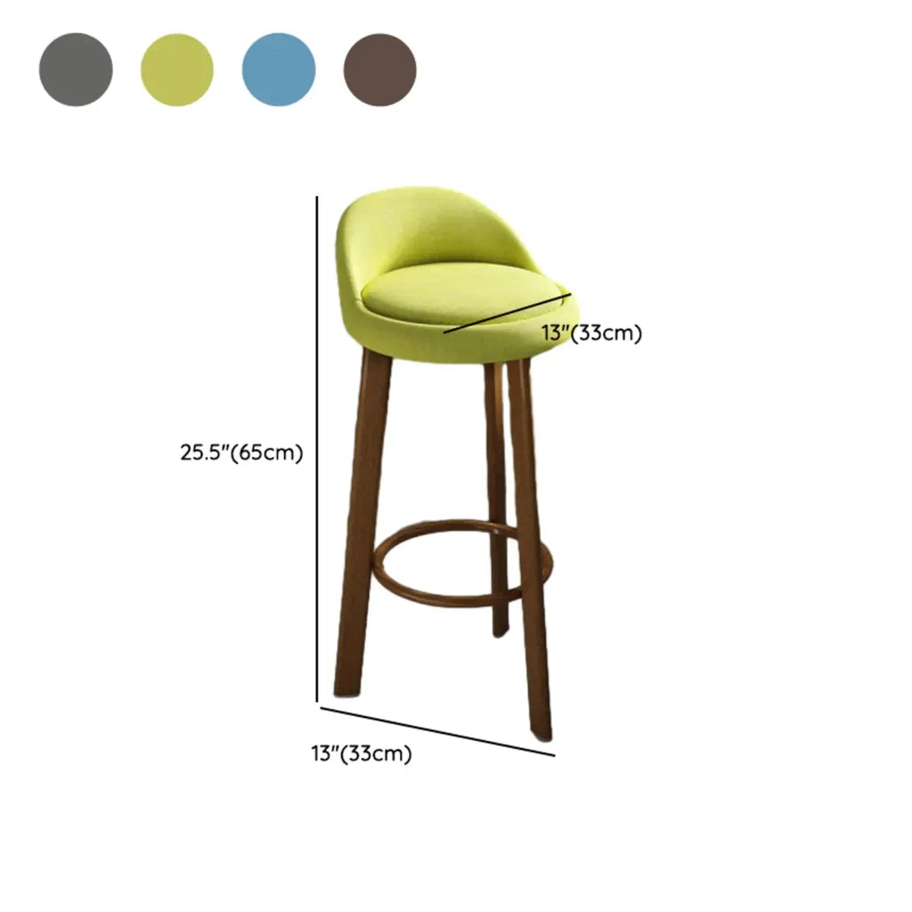 Tabouret de bar élégant et confortable, revêtu de tissu.