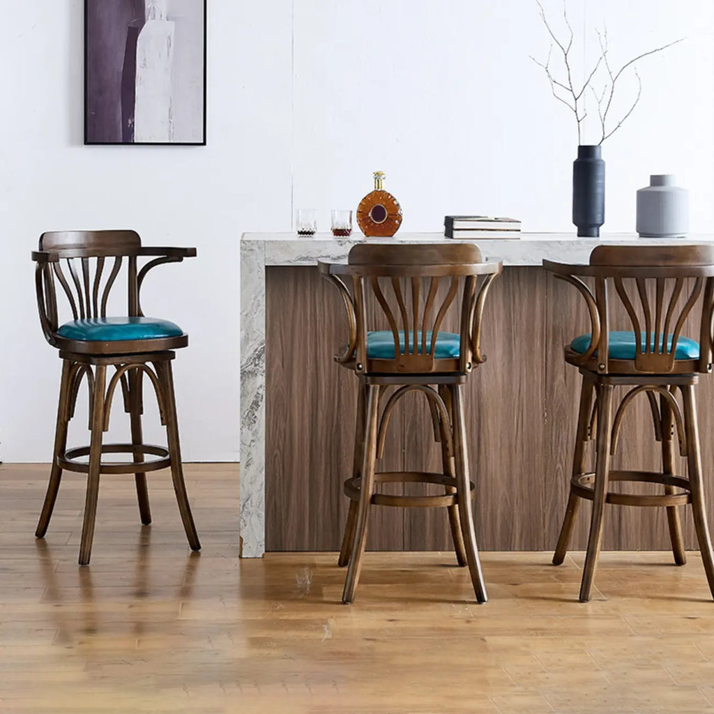 Sgabello da bar girevole imbottito in pelle blu anticata