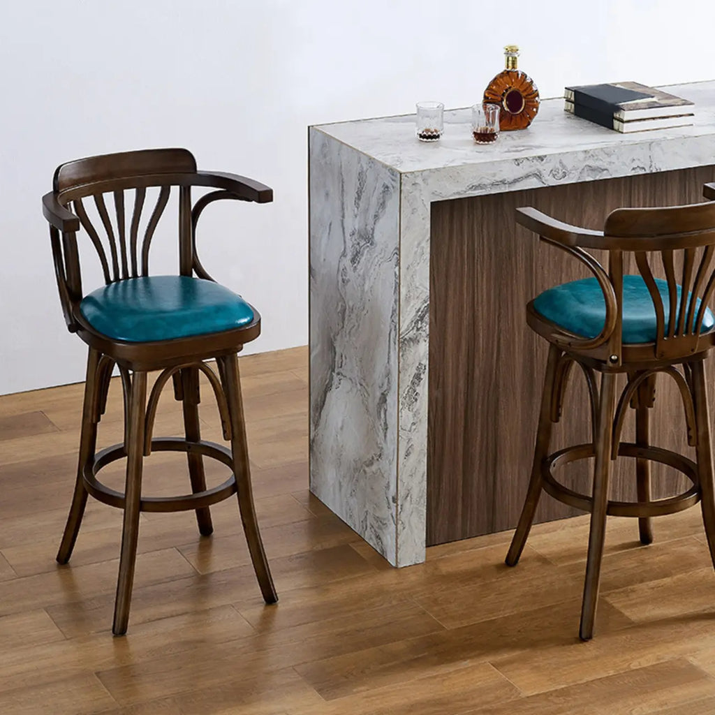 Sgabello da bar girevole imbottito in pelle blu anticata
