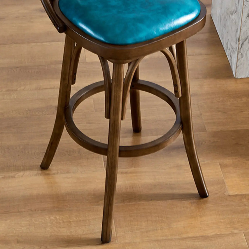 Sgabello da bar girevole imbottito in pelle blu anticata