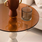 Élégante table d'appoint ronde en verre avec pied central en fer