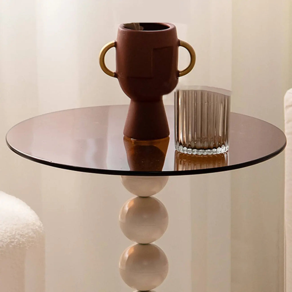 Élégante table d'appoint ronde en verre avec pied central en fer