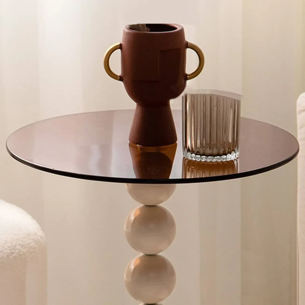 Élégante table d'appoint ronde en verre avec pied central en fer