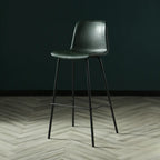 Tabouret de bar industriel en cuir avec structure métallique et repose-pieds