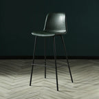 Tabouret de bar industriel en cuir avec structure métallique et repose-pieds