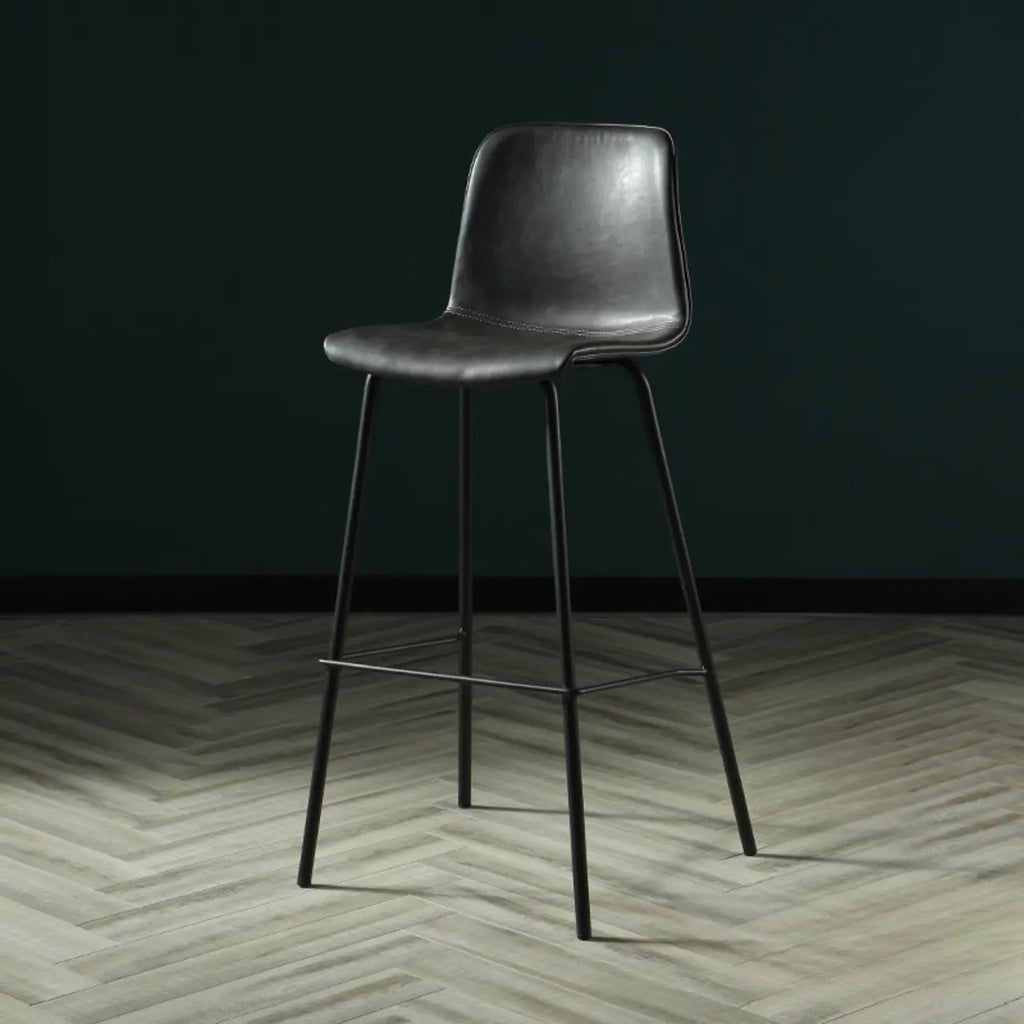Tabouret de bar industriel en cuir avec structure métallique et repose-pieds