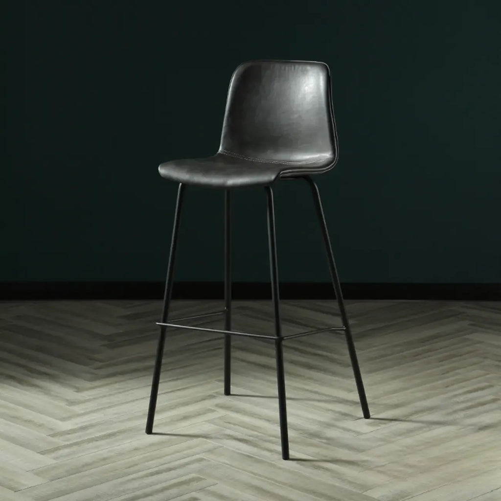 Tabouret de bar industriel en cuir avec structure métallique et repose-pieds