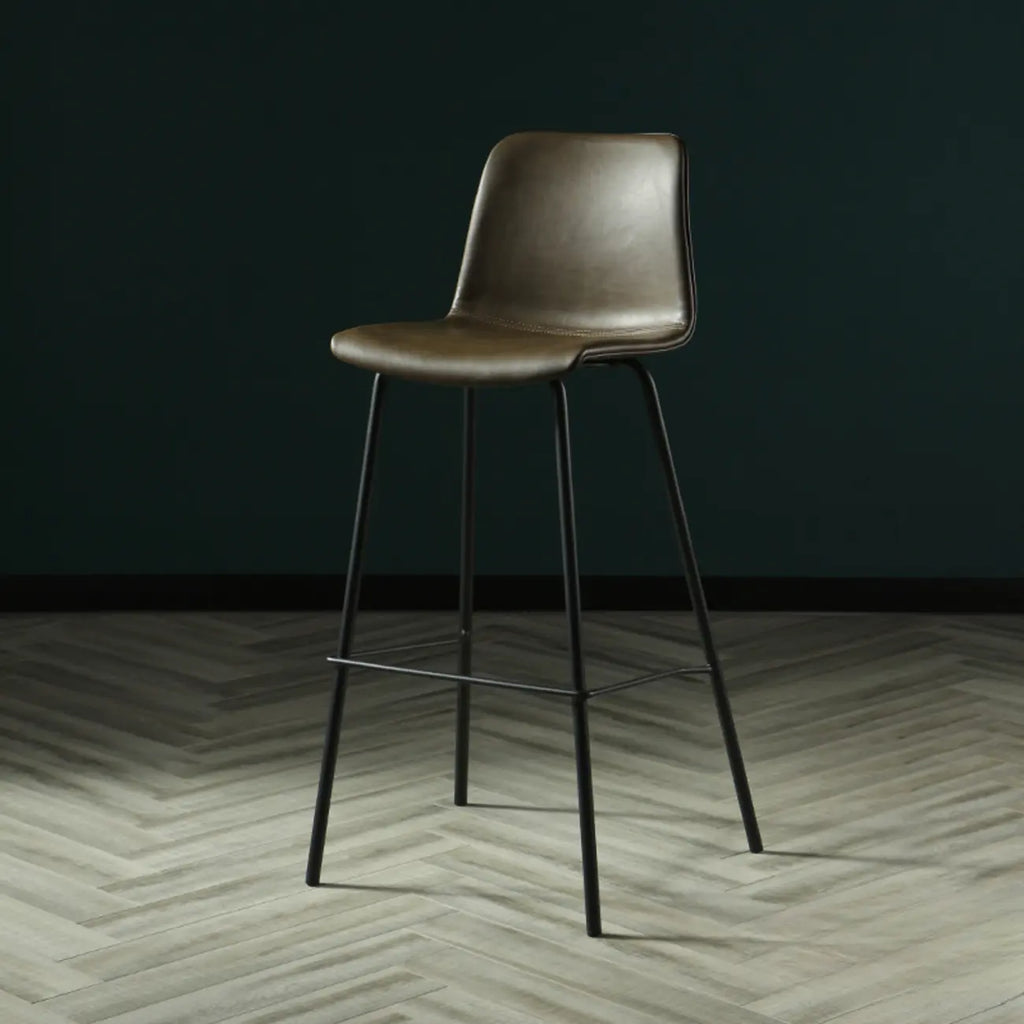 Tabouret de bar industriel en cuir avec structure métallique et repose-pieds