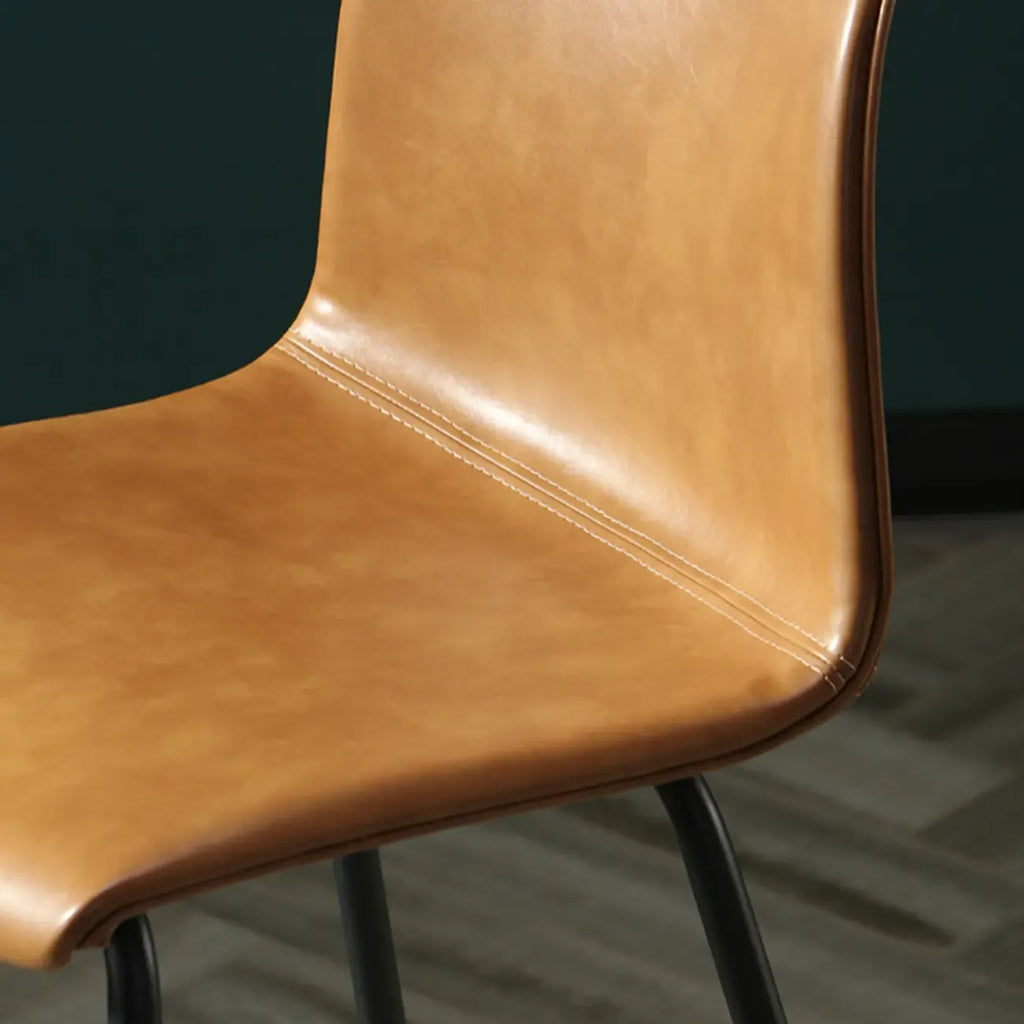 Tabouret de bar industriel en cuir avec structure métallique et repose-pieds
