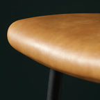 Tabouret de bar industriel en cuir avec structure métallique et repose-pieds