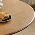 Table de salle à manger ronde en frêne naturel au style épuré