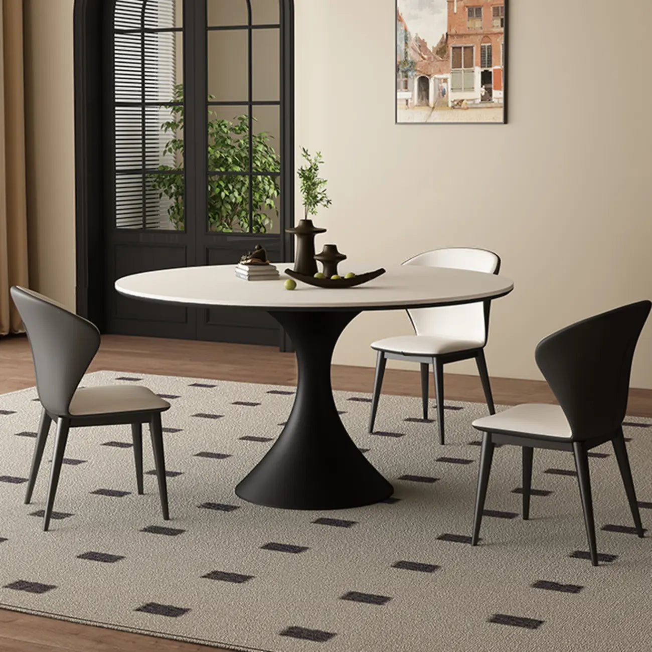 Table de salle à manger ronde moderne avec pied noir et plateau en pierre blanche