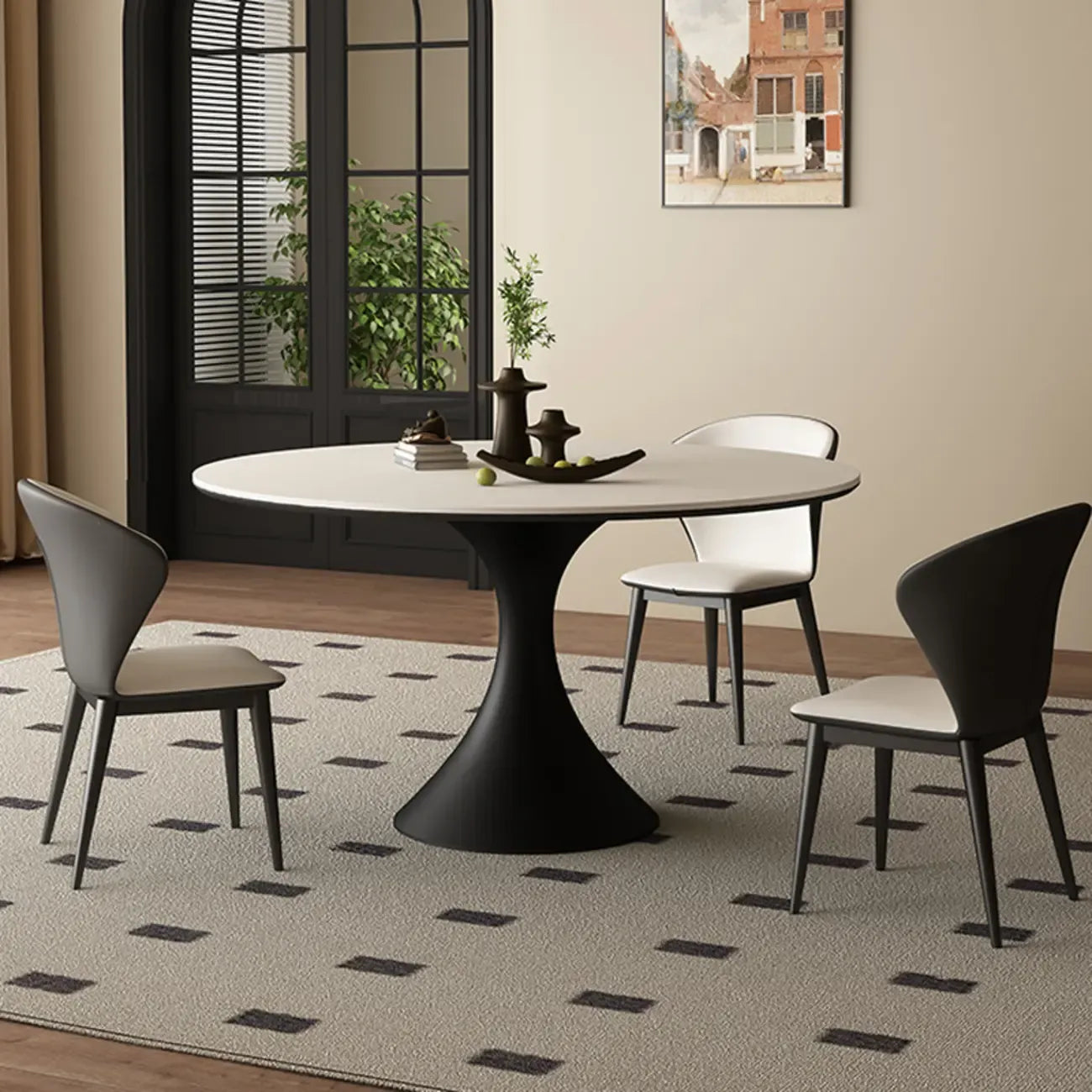 Table de salle à manger ronde moderne avec pied noir et plateau en pierre blanche