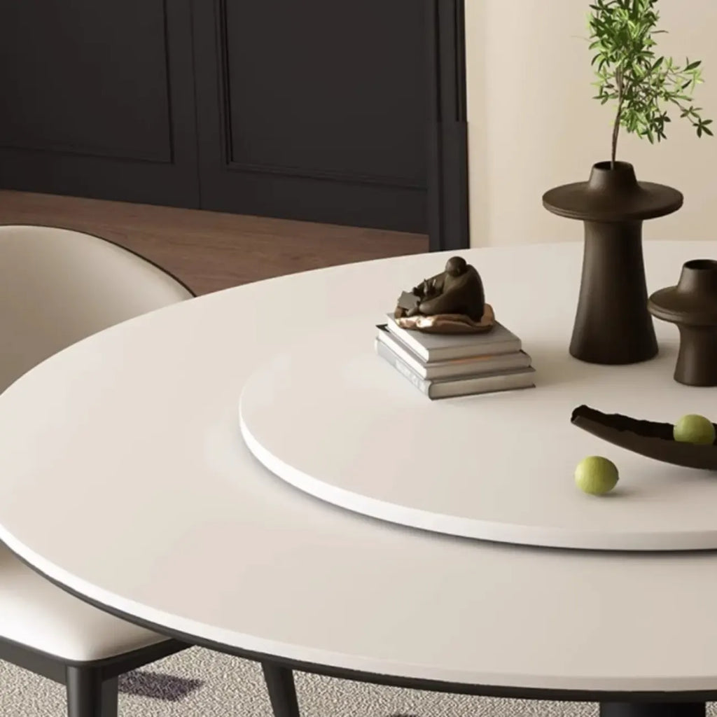 Table de salle à manger ronde moderne avec pied noir et plateau en pierre blanche