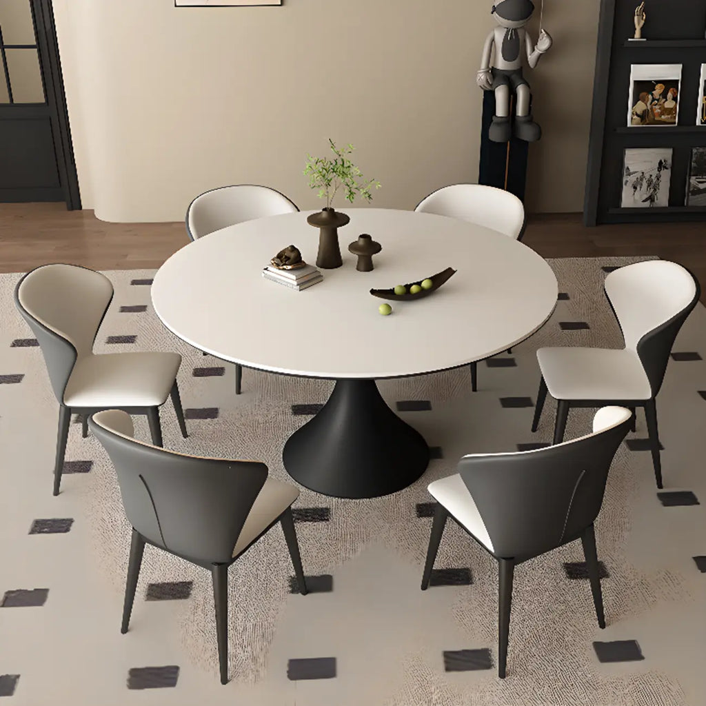 Table de salle à manger ronde moderne avec pied noir et plateau en pierre blanche