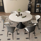 Table de salle à manger ronde moderne avec pied noir et plateau en pierre blanche
