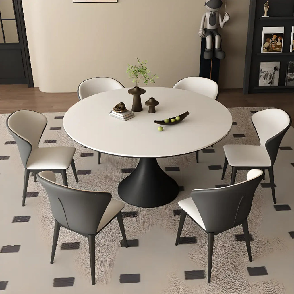 Table de salle à manger ronde moderne avec pied noir et plateau en pierre blanche