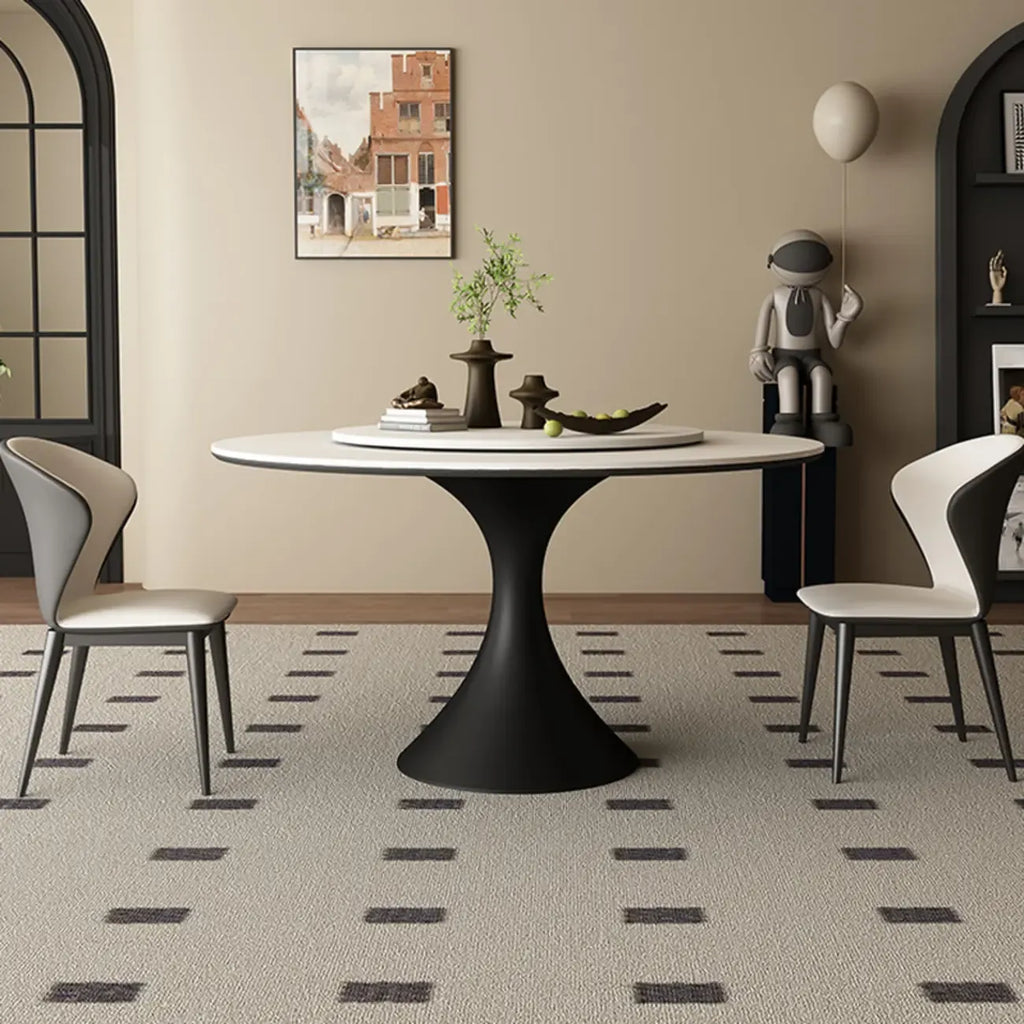 Table de salle à manger ronde moderne avec pied noir et plateau en pierre blanche