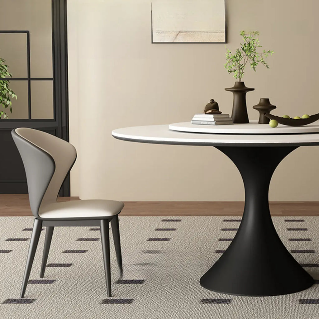 Table de salle à manger ronde moderne avec pied noir et plateau en pierre blanche